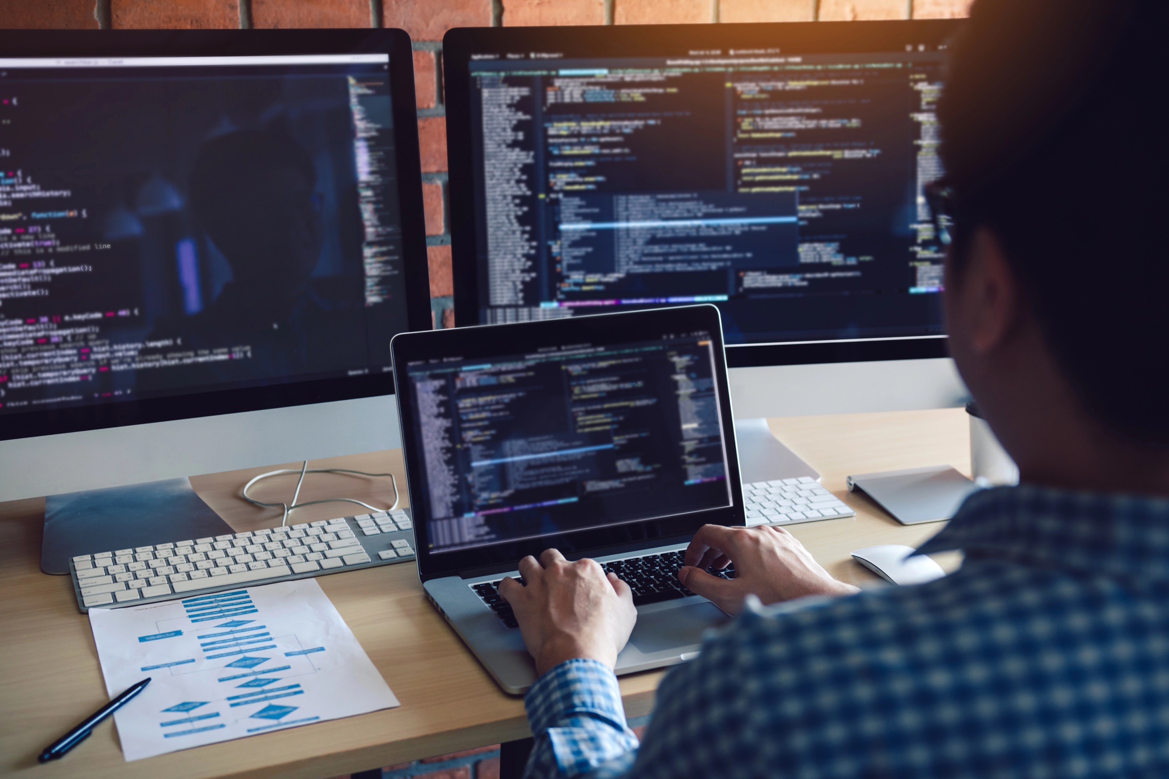IT certification student studying with a laptop and notes
